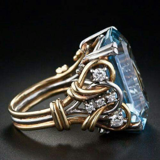 Bague vintage en or avec zircone bleue superposée
