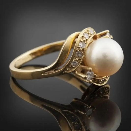 Bague élégante avec perle et or brillant 